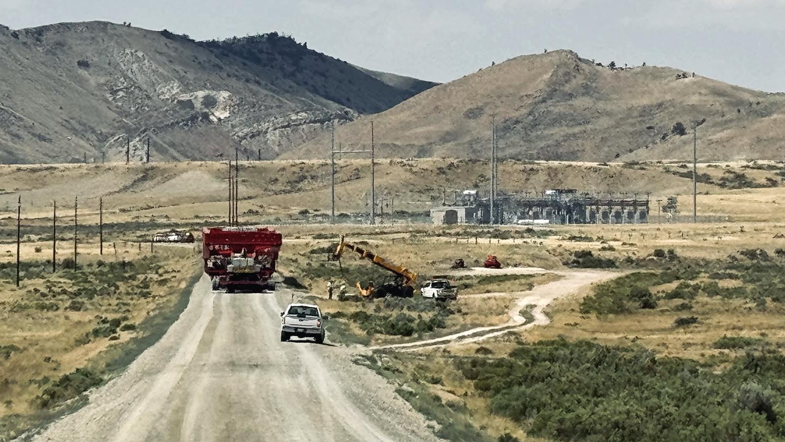 The 375-foot-long specialized heavy truck and trailer carrying a transformer for installation at PacifiCorp’s Aeolus substation, stops just in front of the substation before it is unloaded.