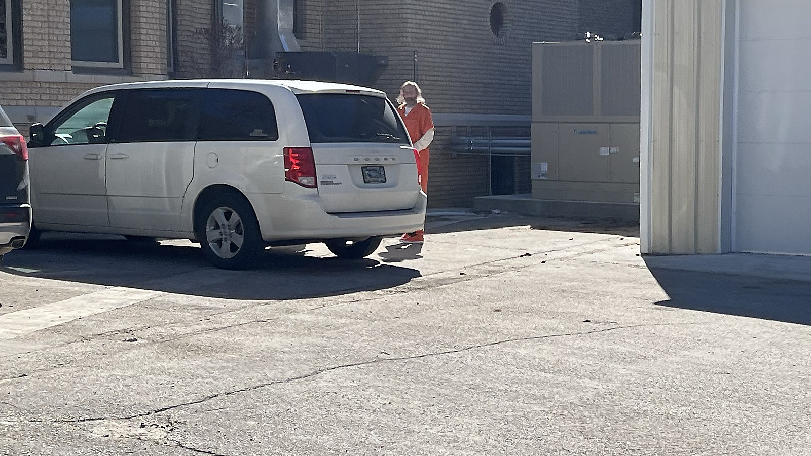 Wearing his jail-issued orange jumpsuit, Arthur Nelson is transported from the Carbon County Courthouse in Rawlins on Wednesday morning.