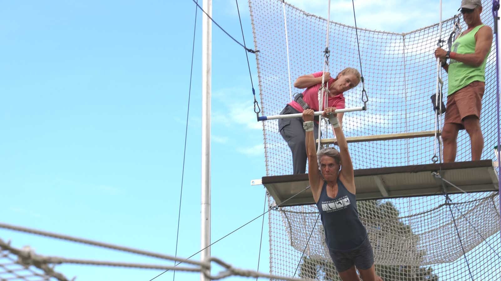 Patty Tobi concentrates as she heads off the trapeze flyer platform.