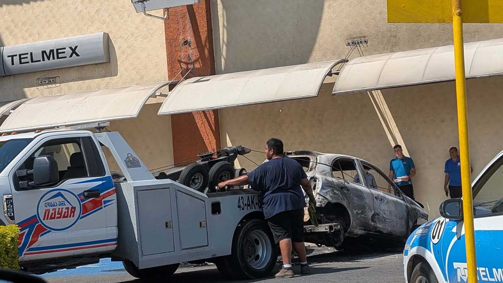 Tow truck crews were out early this week Puerto Vallarta, Mexico, hauling off burned-out vehicles set ablaze by vengeful drug cartel gangsters, after the government killed their leader.