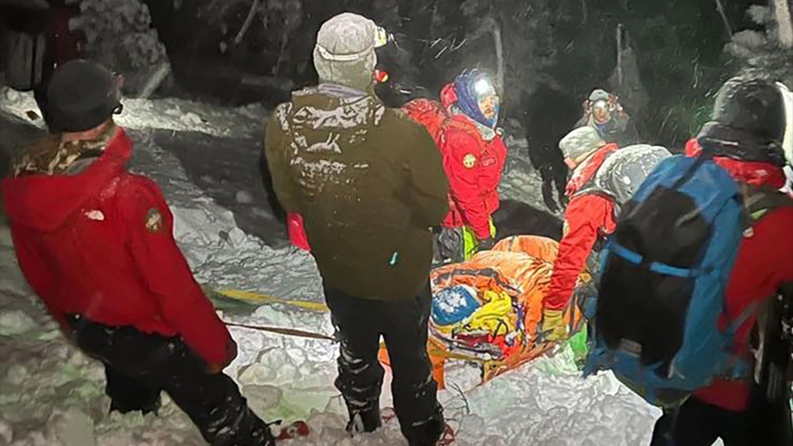 Responders with Teton County Idaho Search and Rescue bring Travis Halverson off the mountain after he was caught in an avalanche skiing in the backcountry on Jan. 12, 2024.