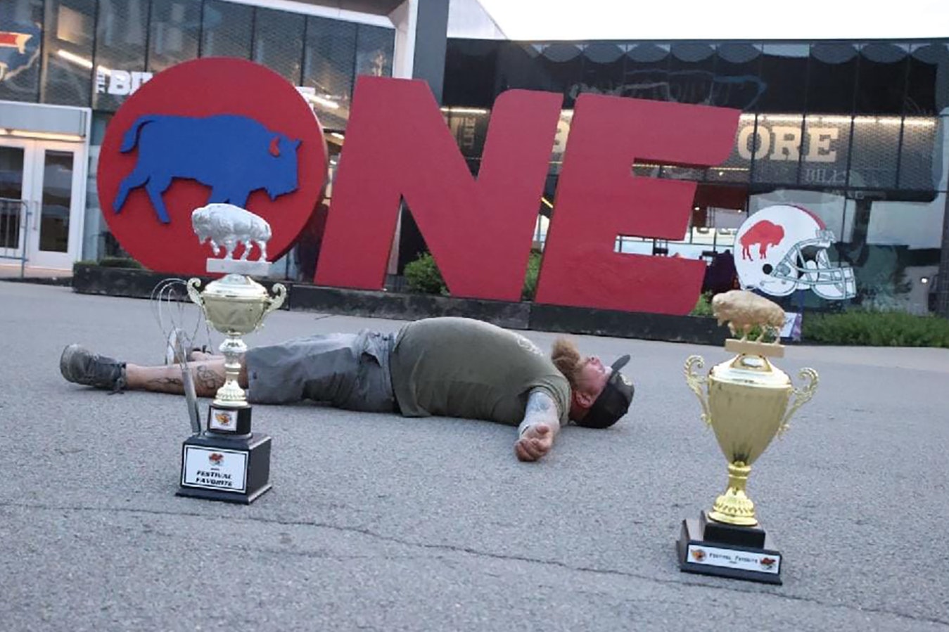 Weitzels Wings owner and founder Trent Weitzel with his back-to-back Festival Favorite trophies for 2022 and 2023 at the National Buffalo Wing Festival in Buffalo, New York.