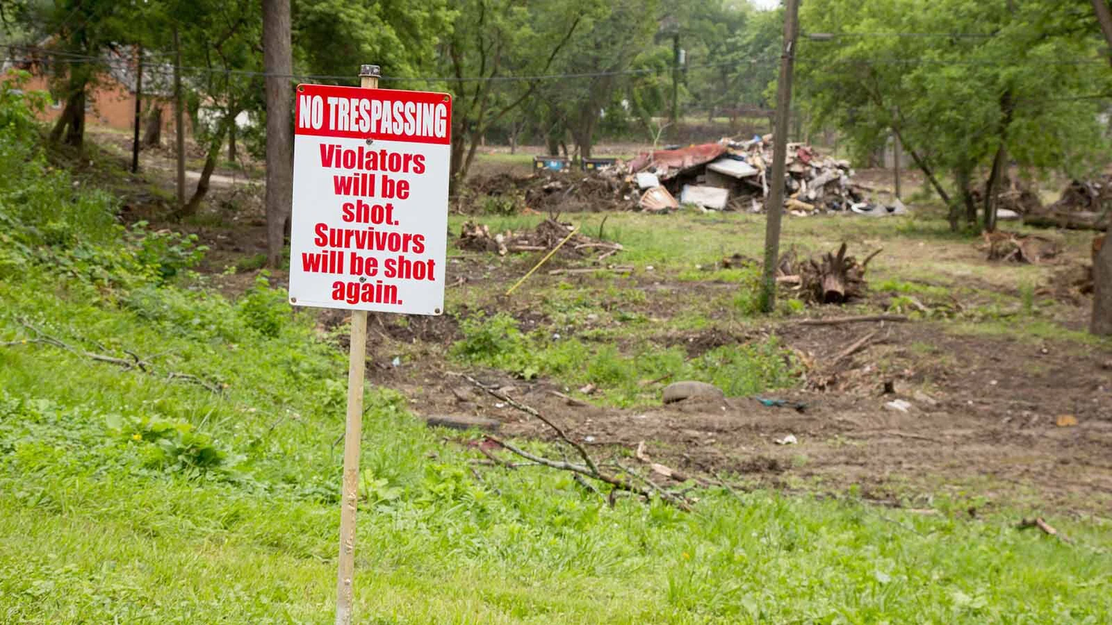 “Trespassers will be shot, survivors will be shot again” makes for a great pro-gun novelty sign, but such messages could open firearms owners to liability or theft, experts say.