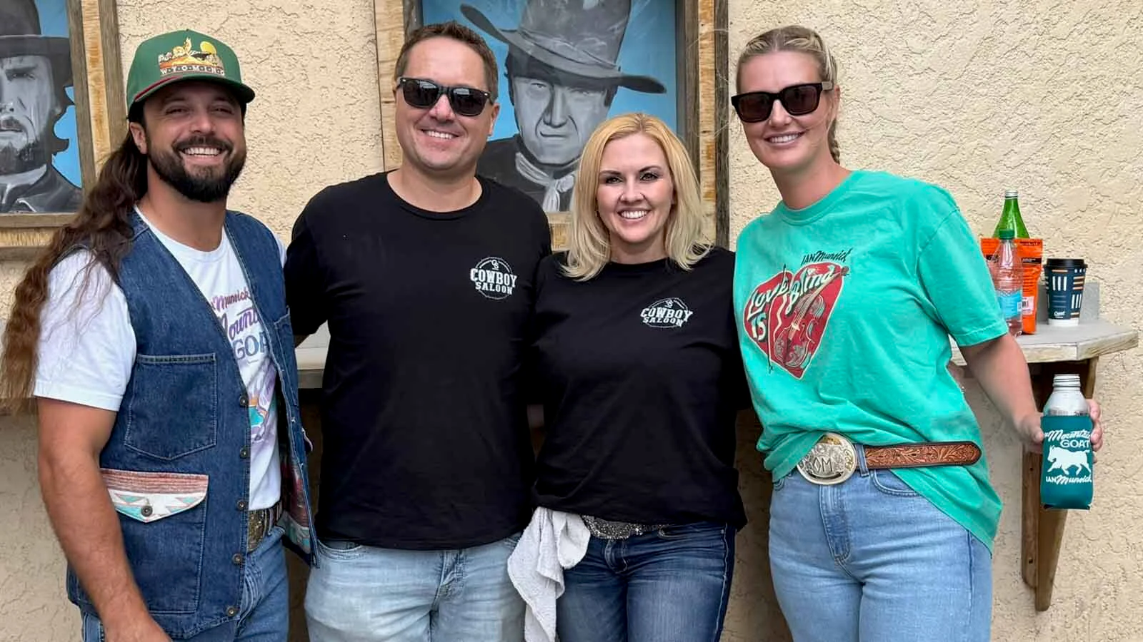 Trevor and Trinity Thatcher, center, pose with Ian and Caroline Munsick at The Cowboy Saloon and Dance Hall.