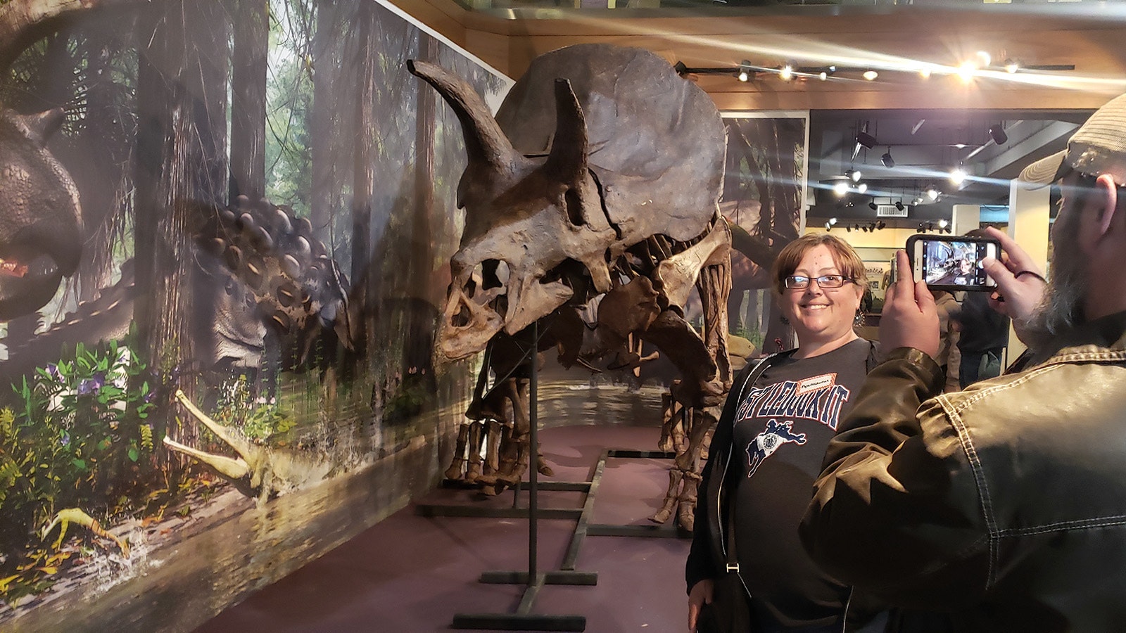 Shelly Araas poses for a selfie with a Triceratops for her classroom taken by her husband Ryan during a recent Jurassic party for the new exhibit at the Wyoming State Museum in Cheyenne.