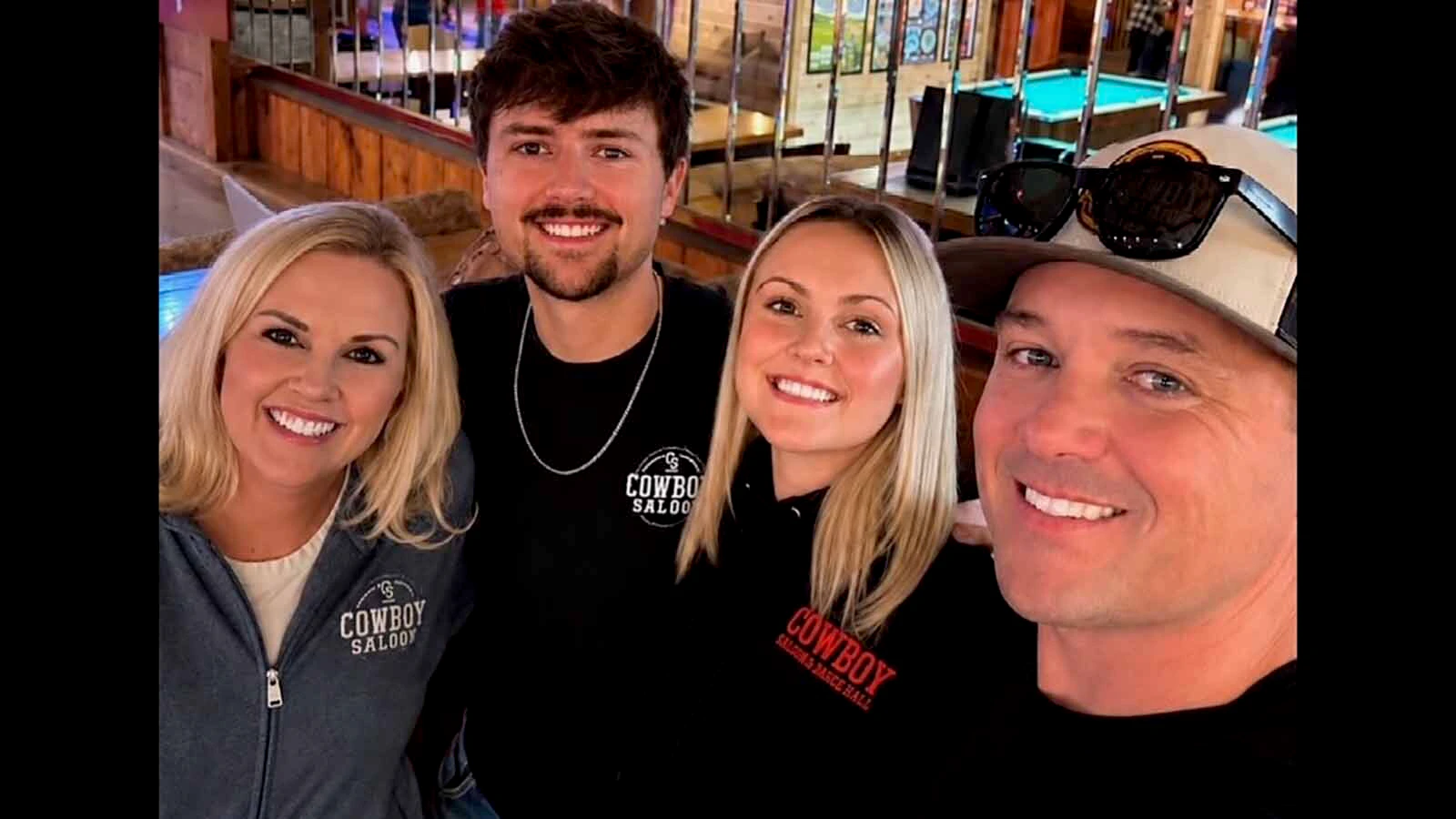 Trevor and Trinity Thatcher, far right, pose with their kids at the Cowboy Saloon and Dance Hall in Laramie.