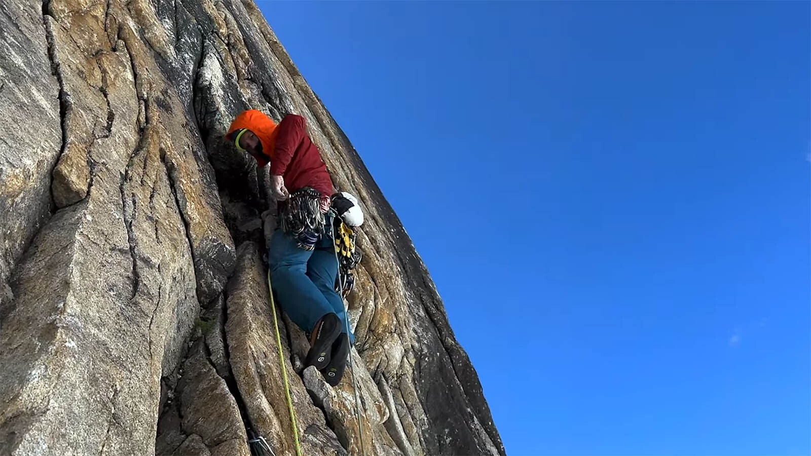 Jesse Huey navigates a sheer rock wall during a July 2023 ascent up the Cowboy Direct route of Trango Towers.