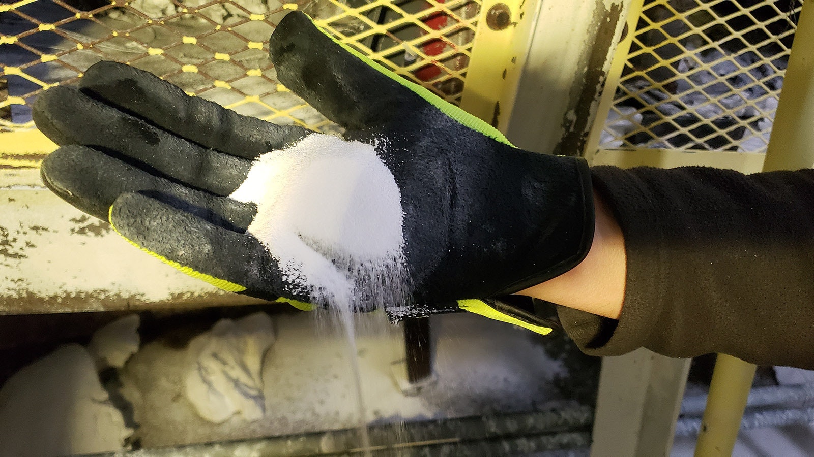 A handful of soda ash just as it's coming off the line at a Genesis Alkali processing plant.
