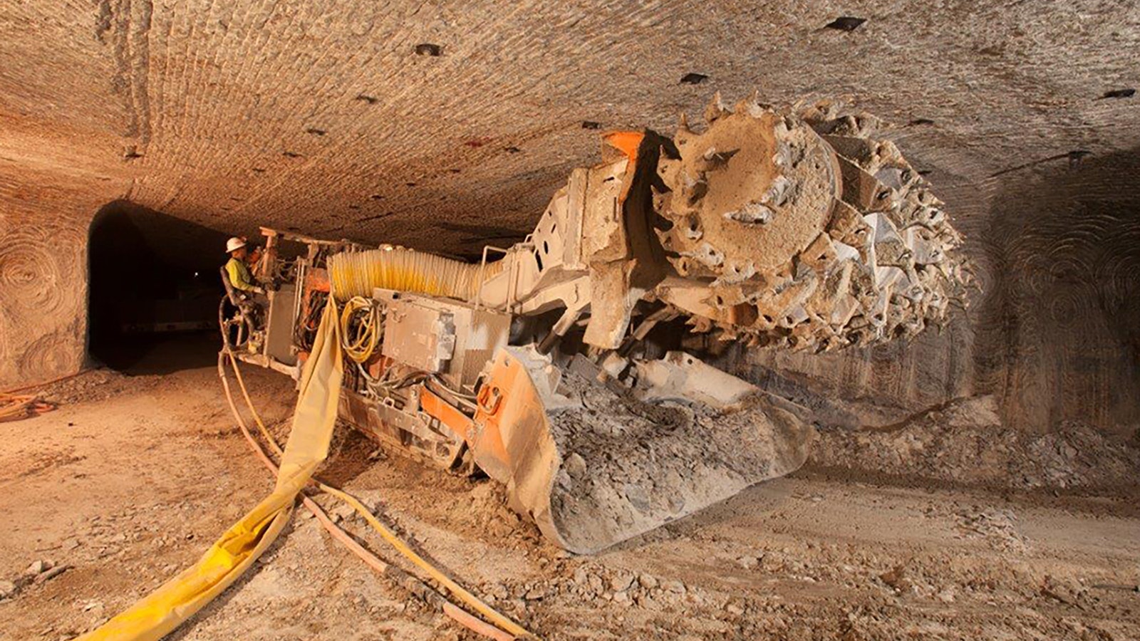 Trona is mined underground, using heavy equipment like this continuous miner. The ore is then carried to the surface and processed.