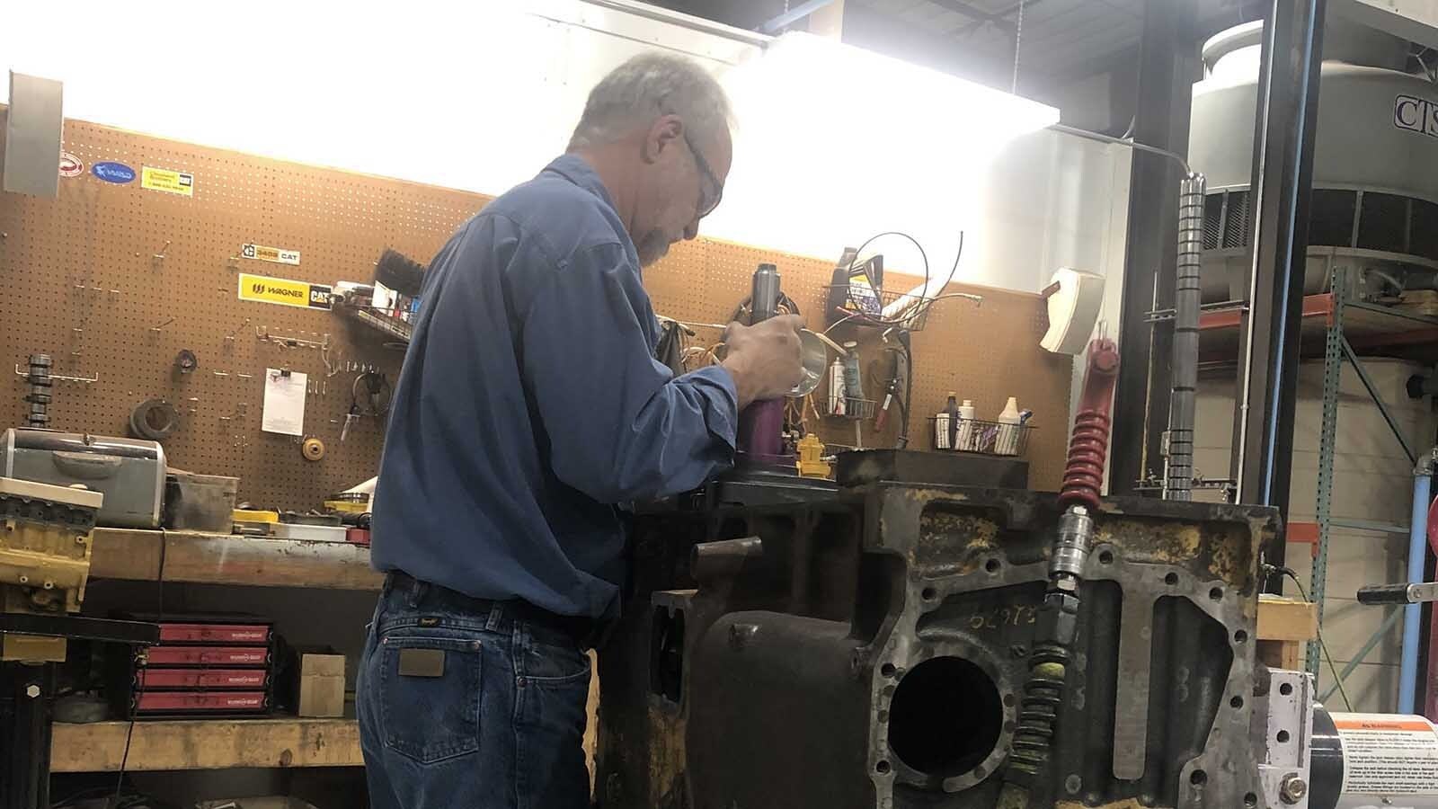 A 65-year-old Wyoming man is in federal prison from pulling EPA-mandated emissions systems from ailing diesel engines. As the Trump administration inches toward reversing those mandates, Troy Lake's family is pushing for the president to pardon him.