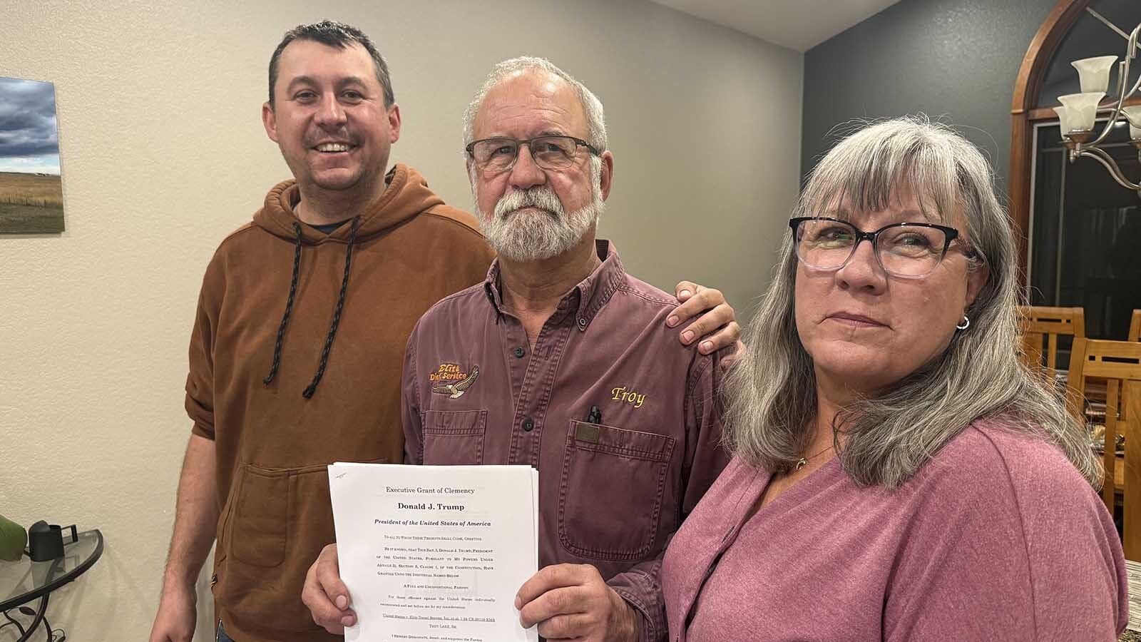 President Donald Trump pardoned Troy Lake on Friday. The 65-year-old Wyoming diesel mechanic spent seven months in federal prison for tweaking and removing emissions systems on ailing engines. When he got the news, he wept. Above, TJ, Troy and Holly Lake with a copy of the pardon from Trump.