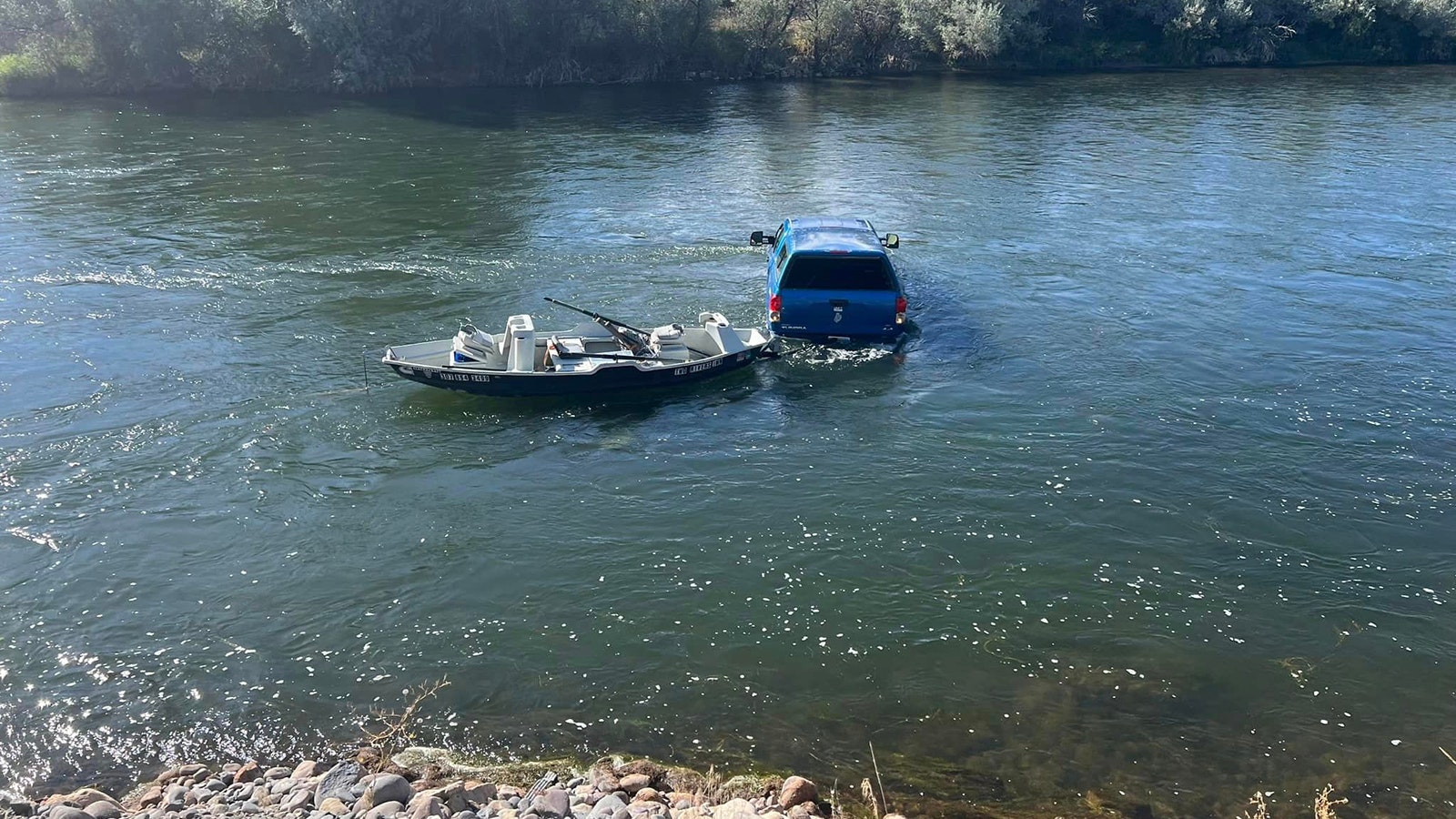 Truck and boat in river 2 10 5 23