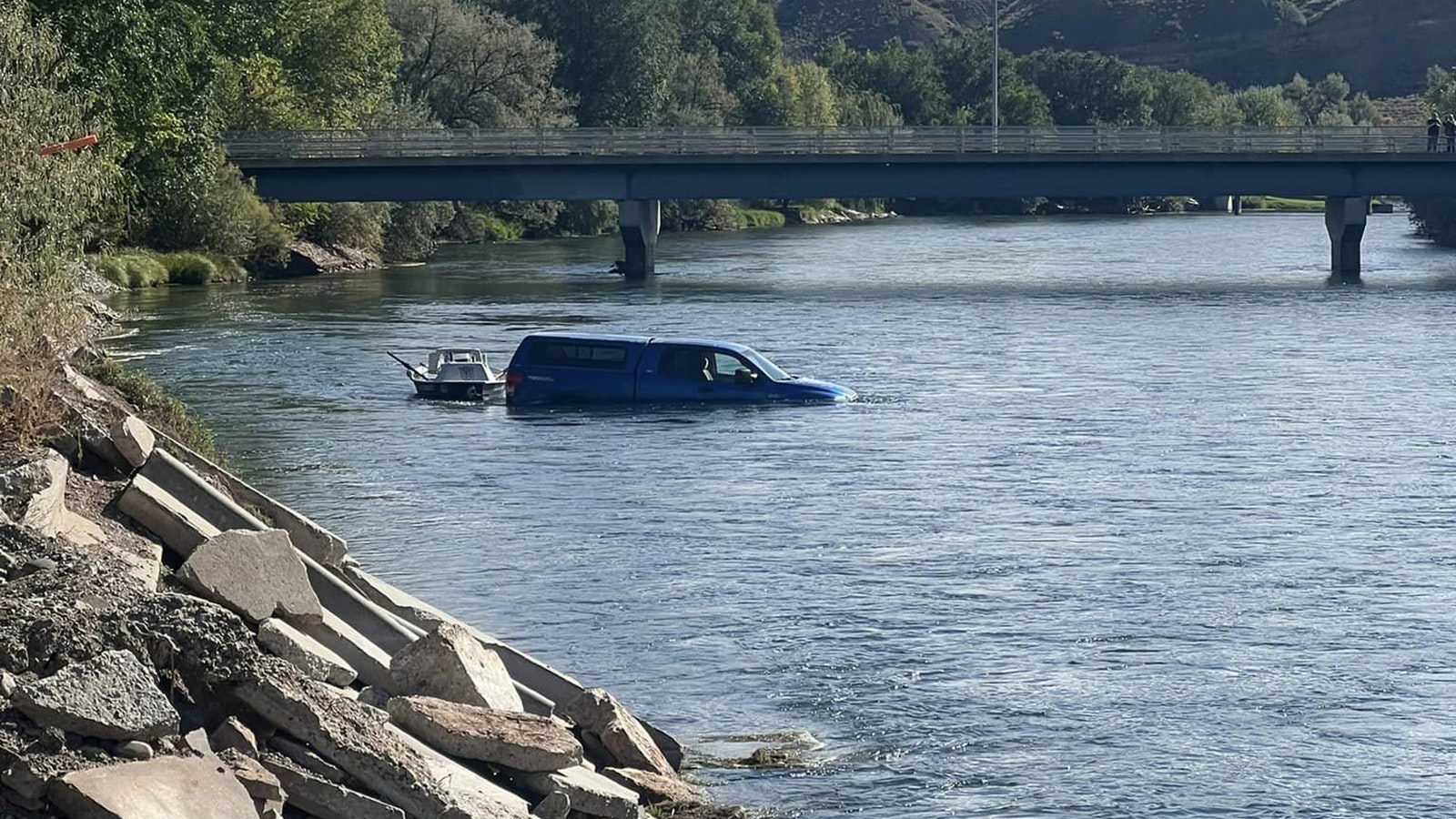 Truck and boat in river 3 10 5 23