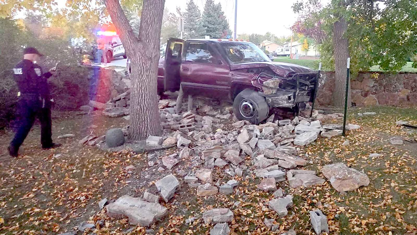 Gillette police respond after a pickup crashed through a stone wall and into Christina Wright’s yard Tuesday evening. Wright said two children and a woman were riding in the pickup with driver Andrew Ruth, and no one appeared to be injured.