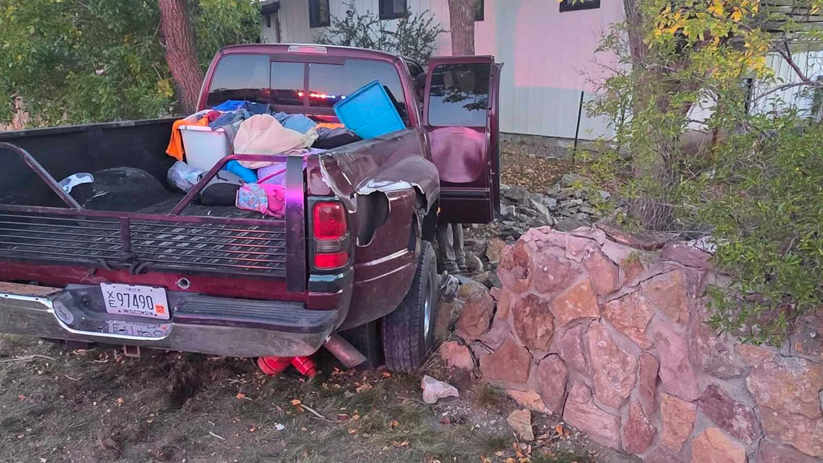 pickup sits amid the remains of a roughly 4-foot stone wall after crashing into Christina Wright’s Gillette yard Tuesday evening. Wright said the truck tore through the wall after leaving 4-J Road in Gillette.