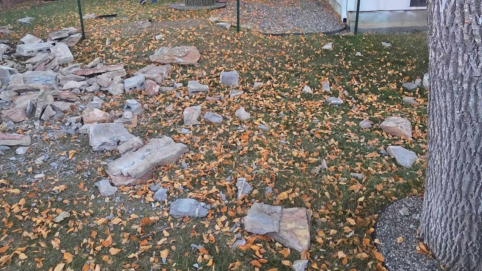 The pickup sustained significant damage after plowing through the heavy stone wall surrounding Christina Wright’s Gillette property Tuesday. Large sections of the wall were knocked apart and scattered across the yard.
