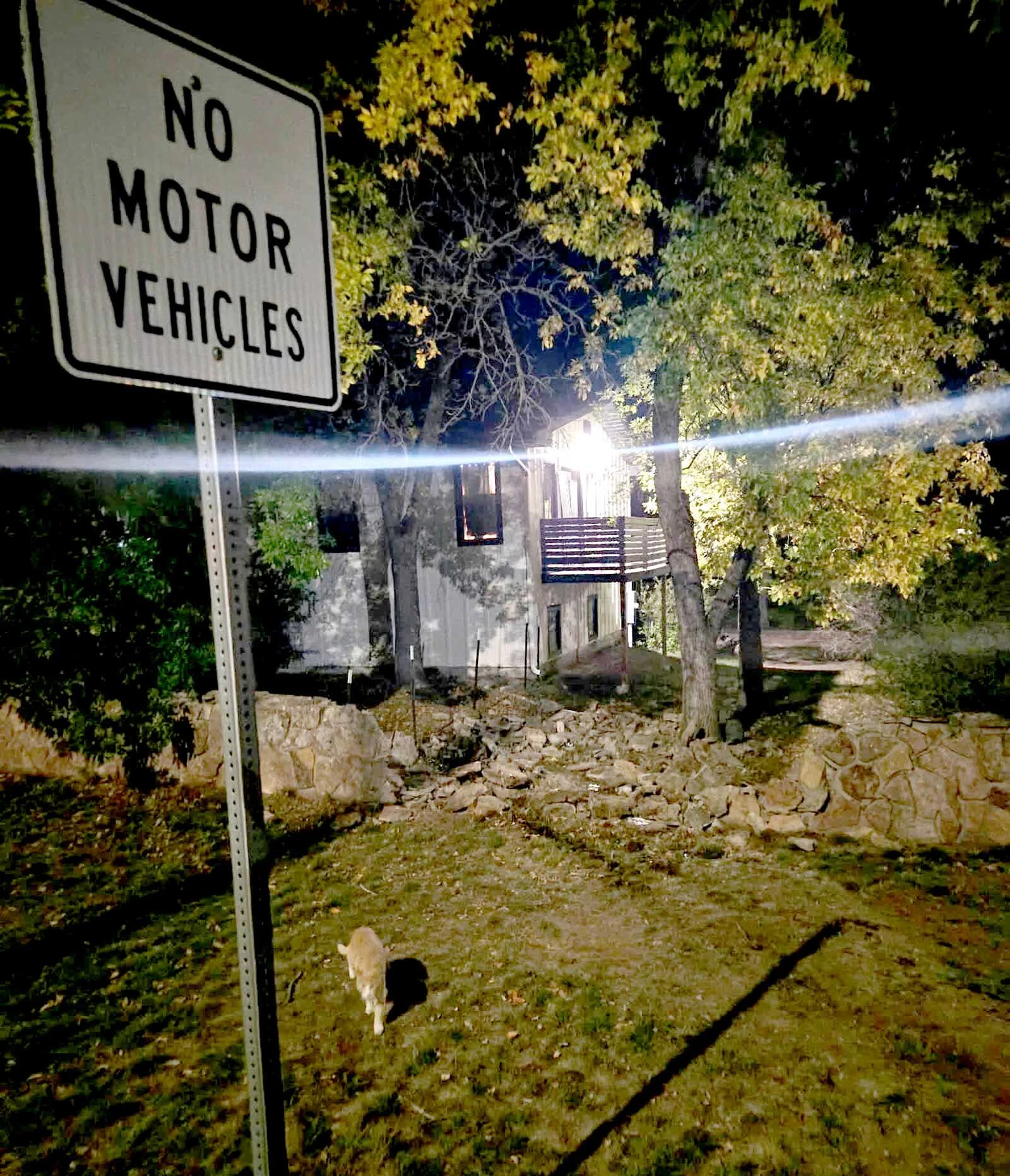A “NO MOTOR VEHICLES” sign remained standing beside the path of destruction after a pickup crashed through Christina Wright’s stone wall and into her Gillette yard Tuesday evening.