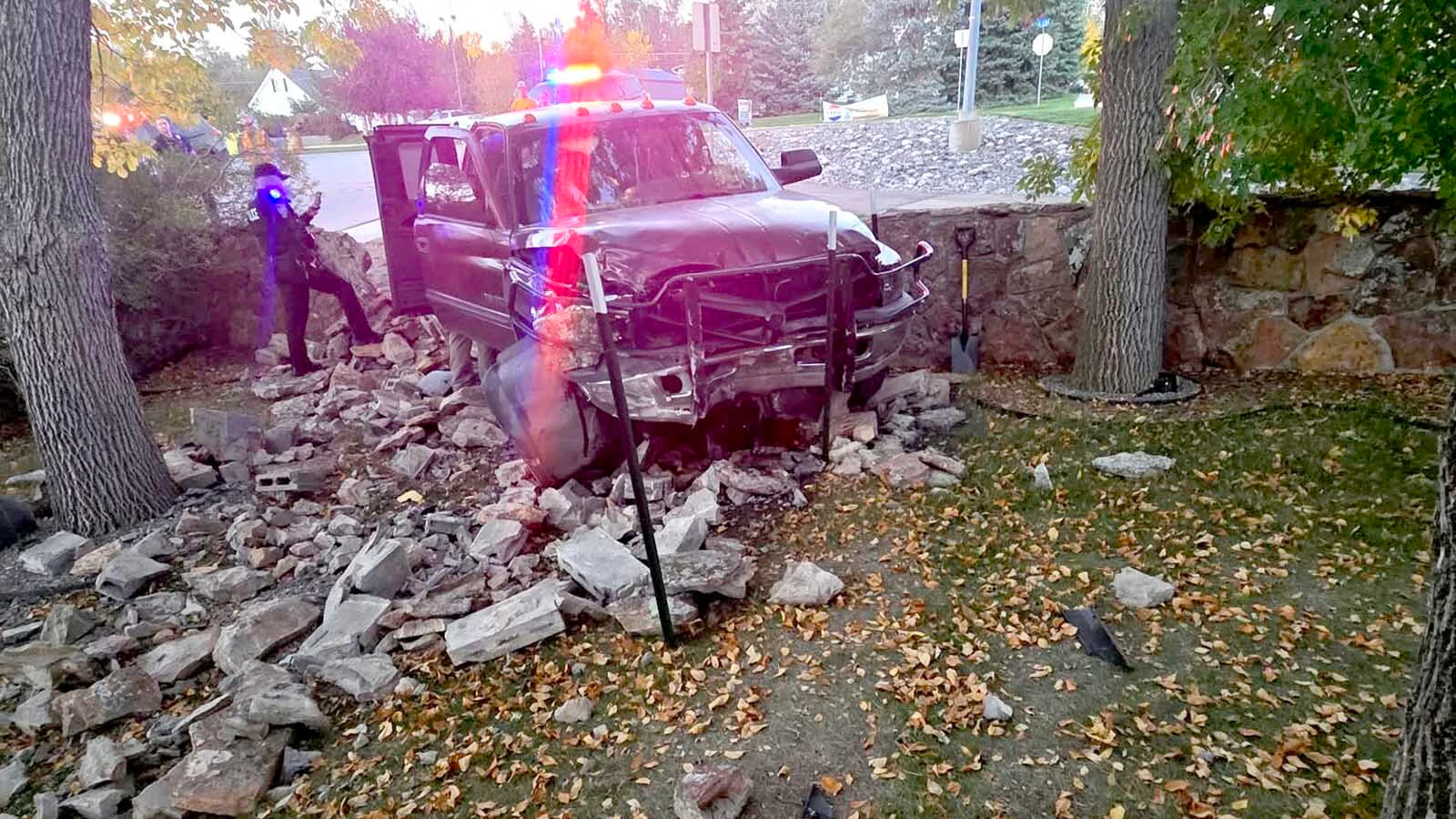 Gillette police respond after a pickup crashed through a stone wall and into Christina Wright’s yard Tuesday evening. Wright said two children and a woman were riding in the pickup with driver Andrew Ruth, and no one appeared to be injured.