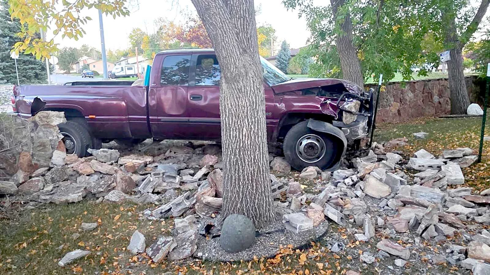 pickup sits amid the remains of a roughly 4-foot stone wall after crashing into Christina Wright’s Gillette yard Tuesday evening. Wright said the truck tore through the wall after leaving 4-J Road in Gillette.