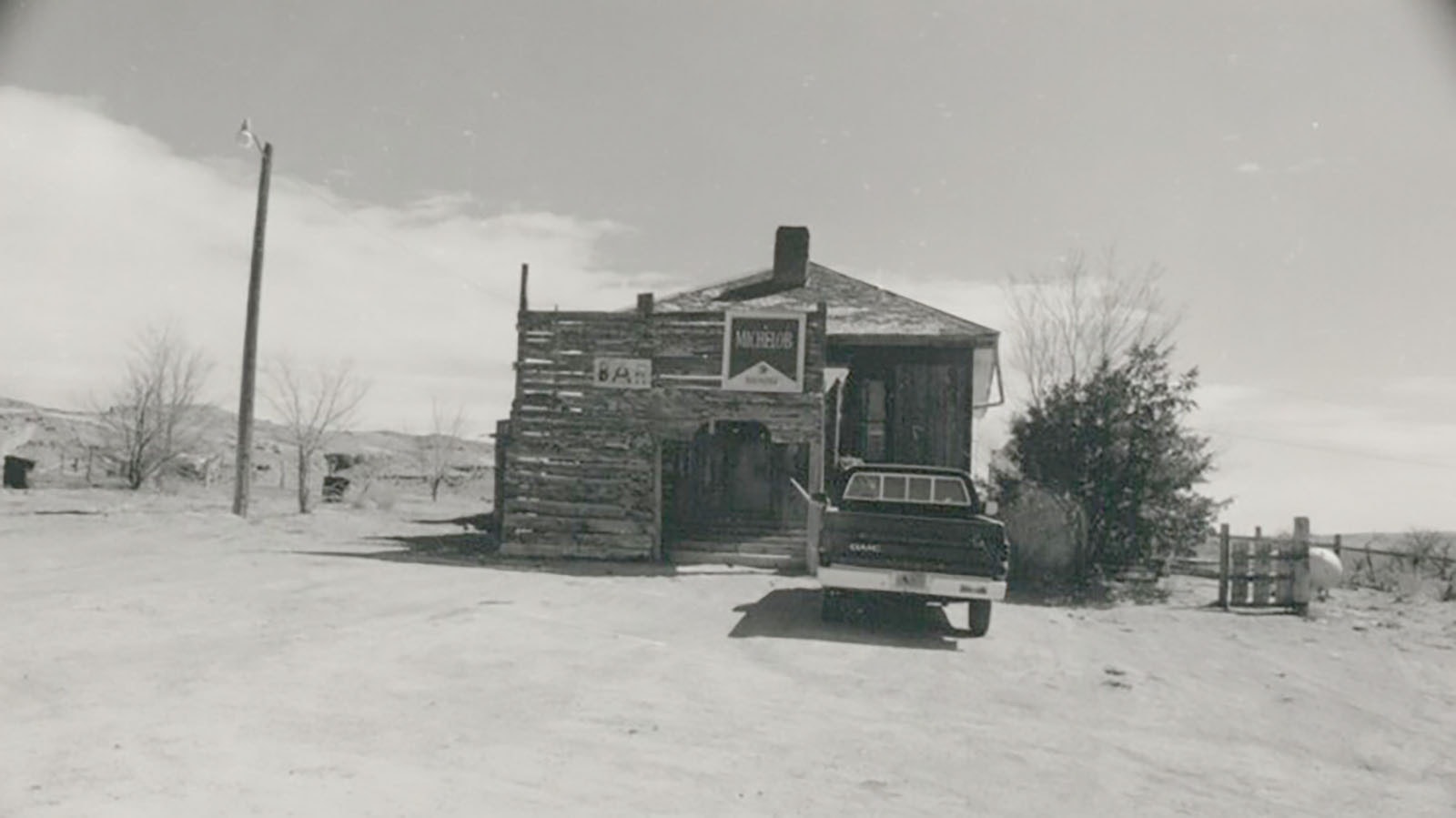 The Bonneville Bar in either 1987 or 1988 in a photo by Robert C. Cutshaw. In 1921, the town became the end of the road for a truck driver hauling nitroglycerine and his passenger.