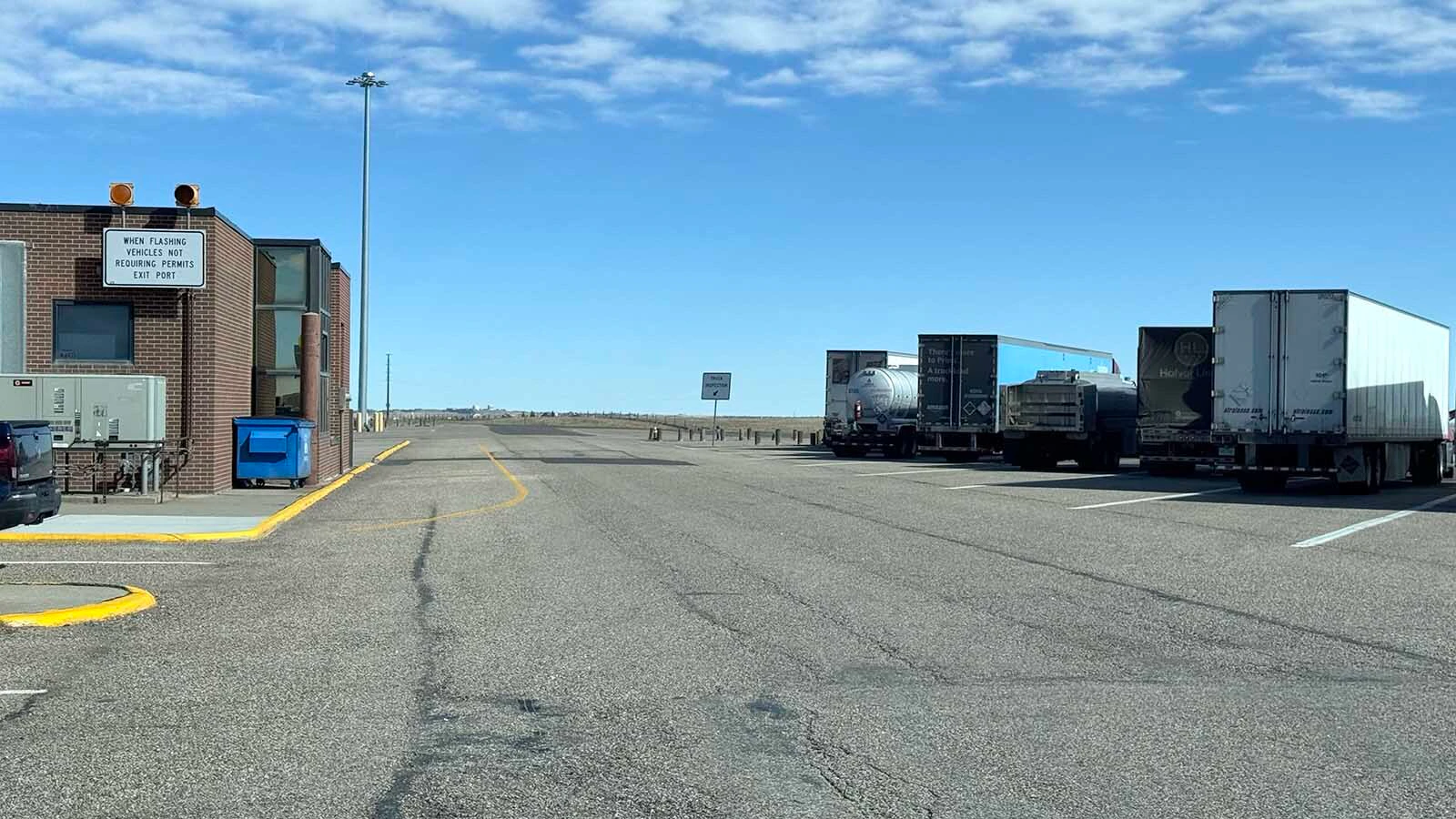 Trucks parked at the Wyoming port of entry just south of Cheyenne. Workers at ports of entry can be observant to spot signs of human trafficking.