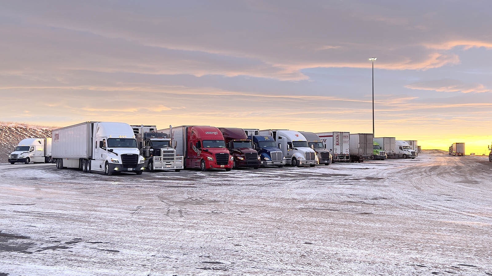 Dozens of trucks park in a lot off Interstate 80 to wait out last weekend's polar vortex freeze that shut down much of Wyoming with temperatures hitting minus 30 and below in some places.