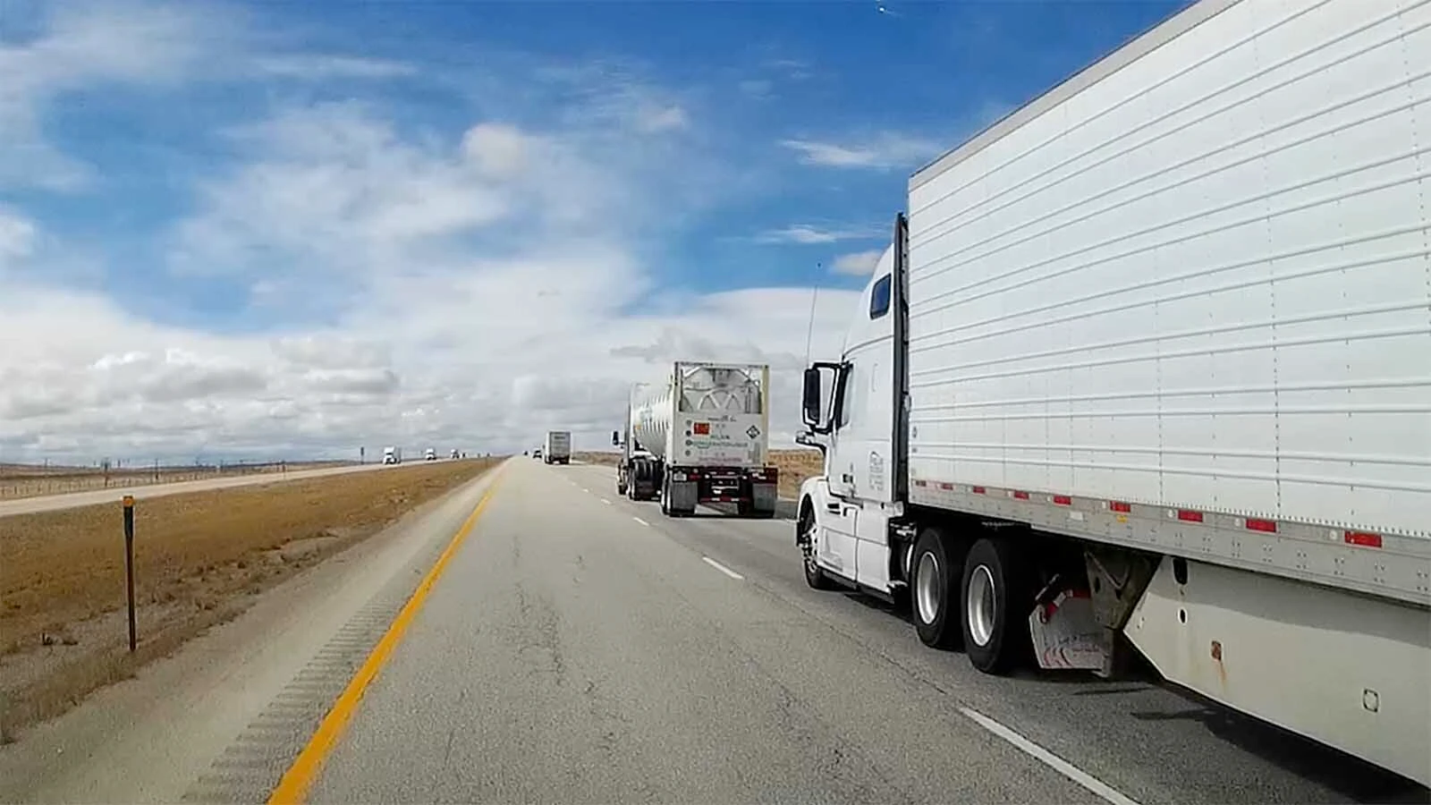 Interstate 80 across southern Wyoming is one of the nation's busiest trucking routes. Pictured is a stretch of I-80 between Cheyenne and Laramie in a Cowboy State Daily file photo.