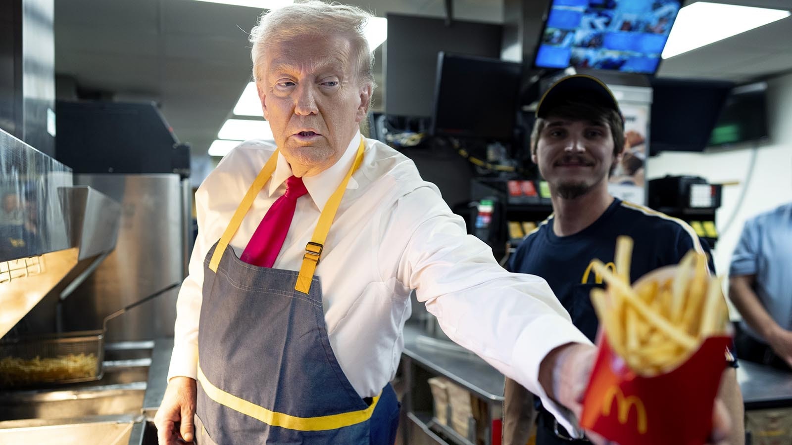 Republican presidential nominee, former U.S. President Donald Trump works behind the counter during a campaign event at McDonald's restaurant on Oct. 20, 2024 in Feasterville-Trevose, Pennsylvania.