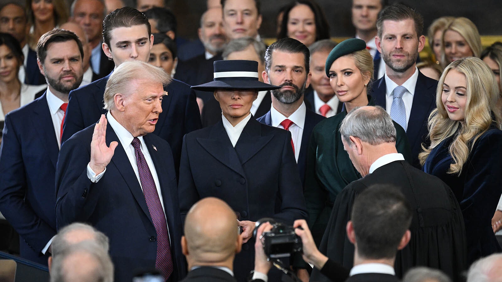 Donald Trump is sworn into office by Supreme Court Chief Justice John Roberts as Melania Trump holds the Bible in the U.S. Capitol Rotunda on Jan. 20, 2025, in Washington, D.C. Donald Trump takes office for his second term as the 47th president of the United States.