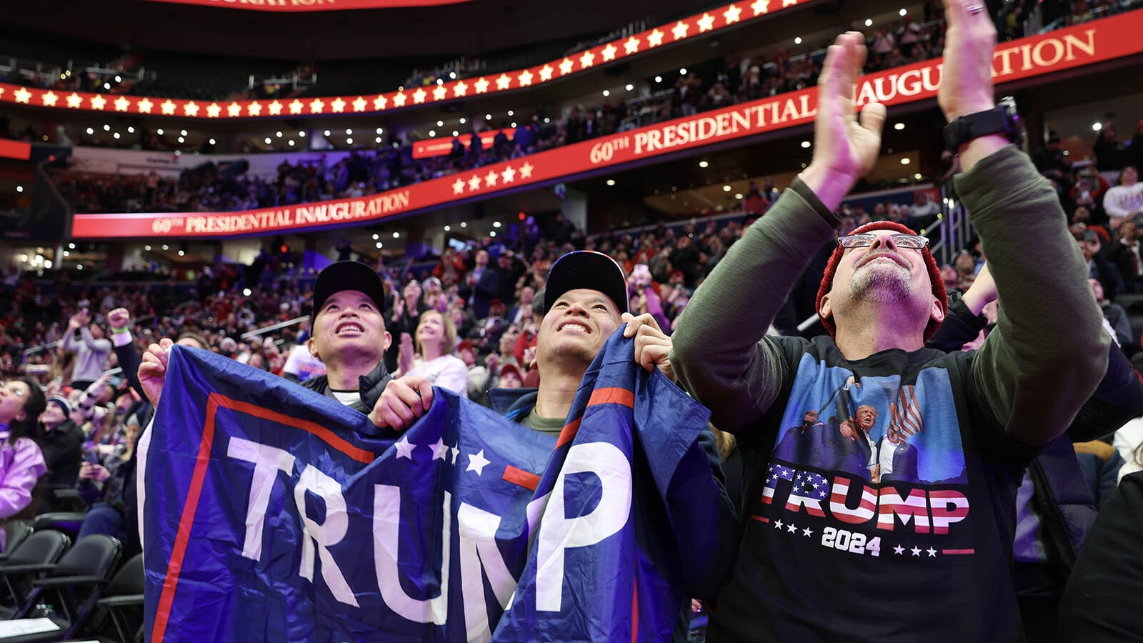 People watch the inauguration of U.S. President Donald Trump from the Capital One Arena on Jan. 20, 2025, in Washington, D.C. Donald Trump takes office for his second term as the 47th president of the United States.