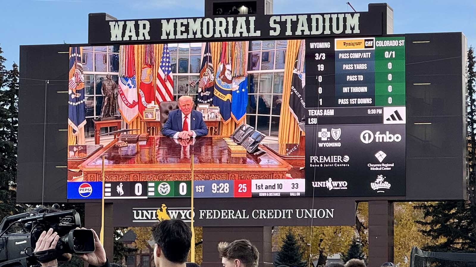 A video message from President Donald Trump plays on the scoreboard at War Memorial Stadium during the Border War football game on Saturday, Oct. 25, 2025, in Laramie, Wyoming.