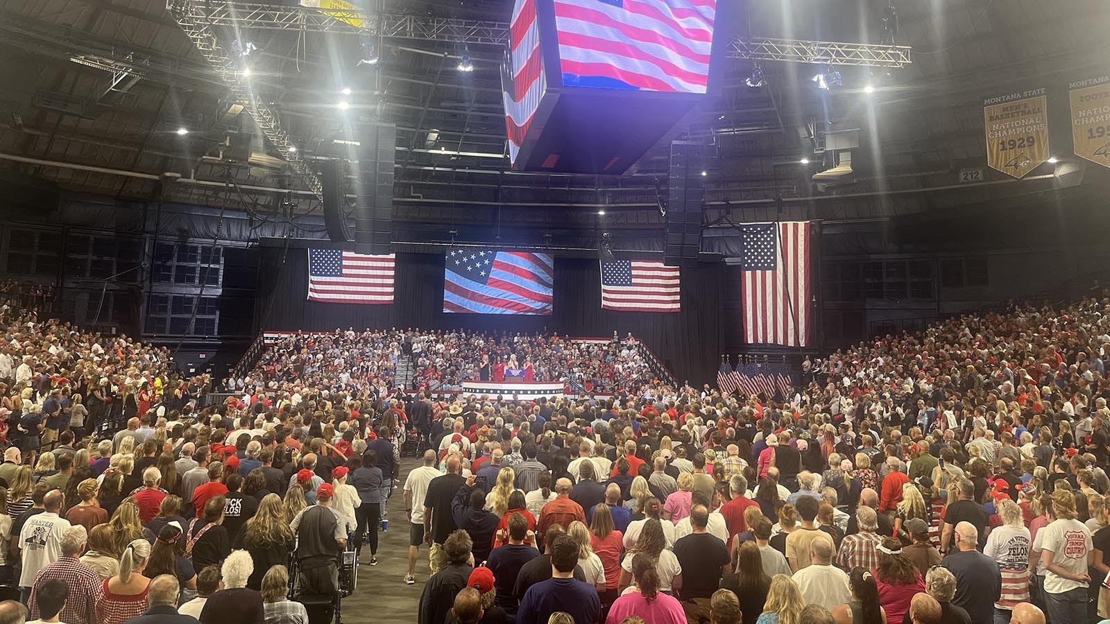 The crowd stands for the national anthem on Friday.