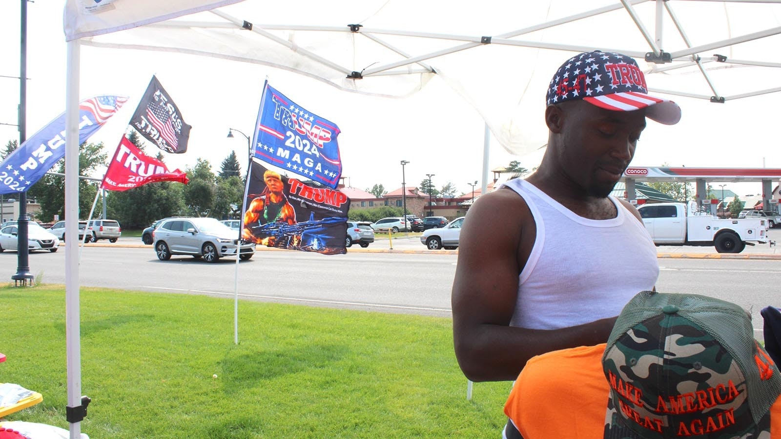 A vendor from South Carolina travels the country selling Trump apparel. He goes by Black Trump Supporter.