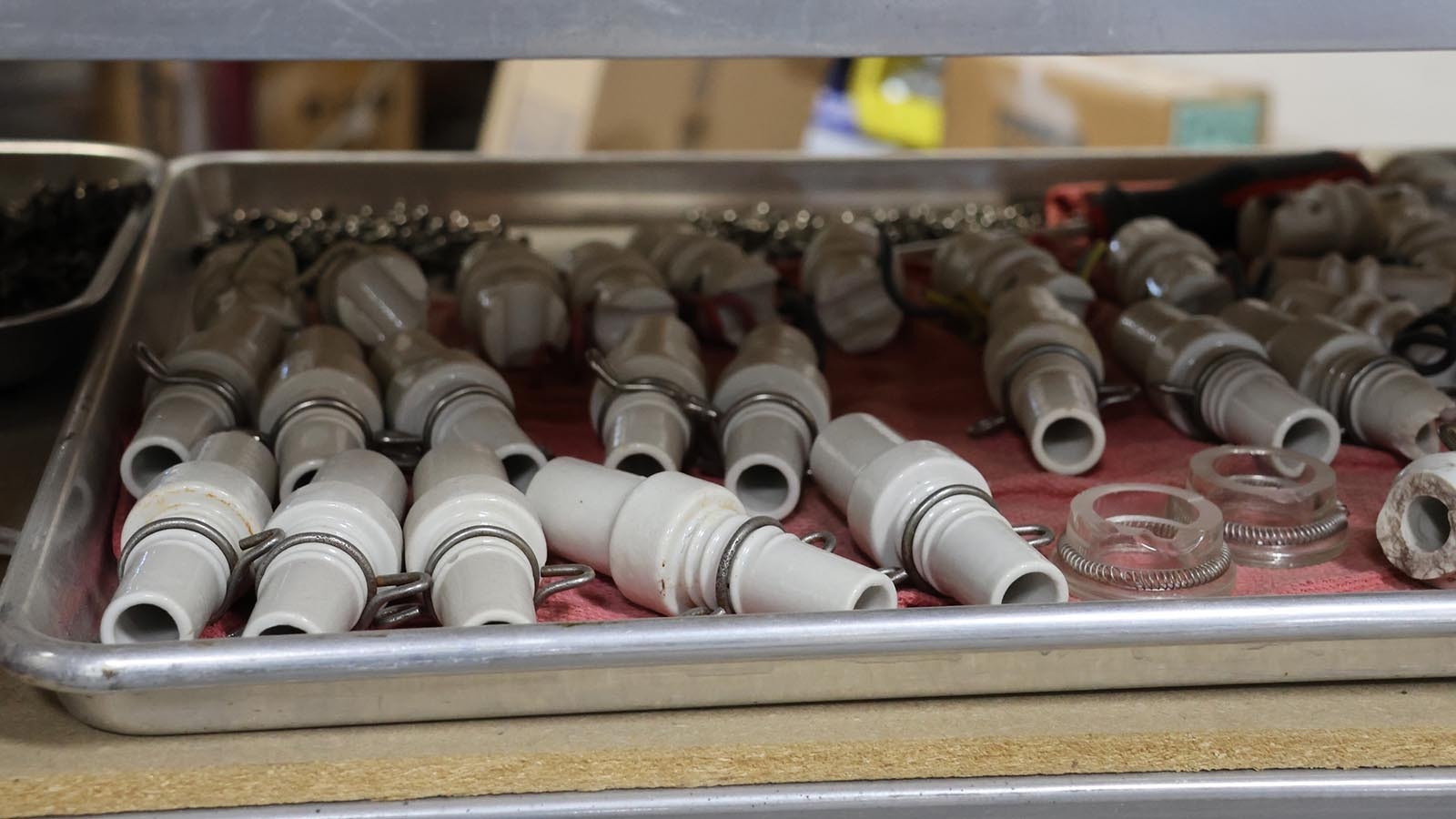 Insulators for wiring and glass installation on the sign.