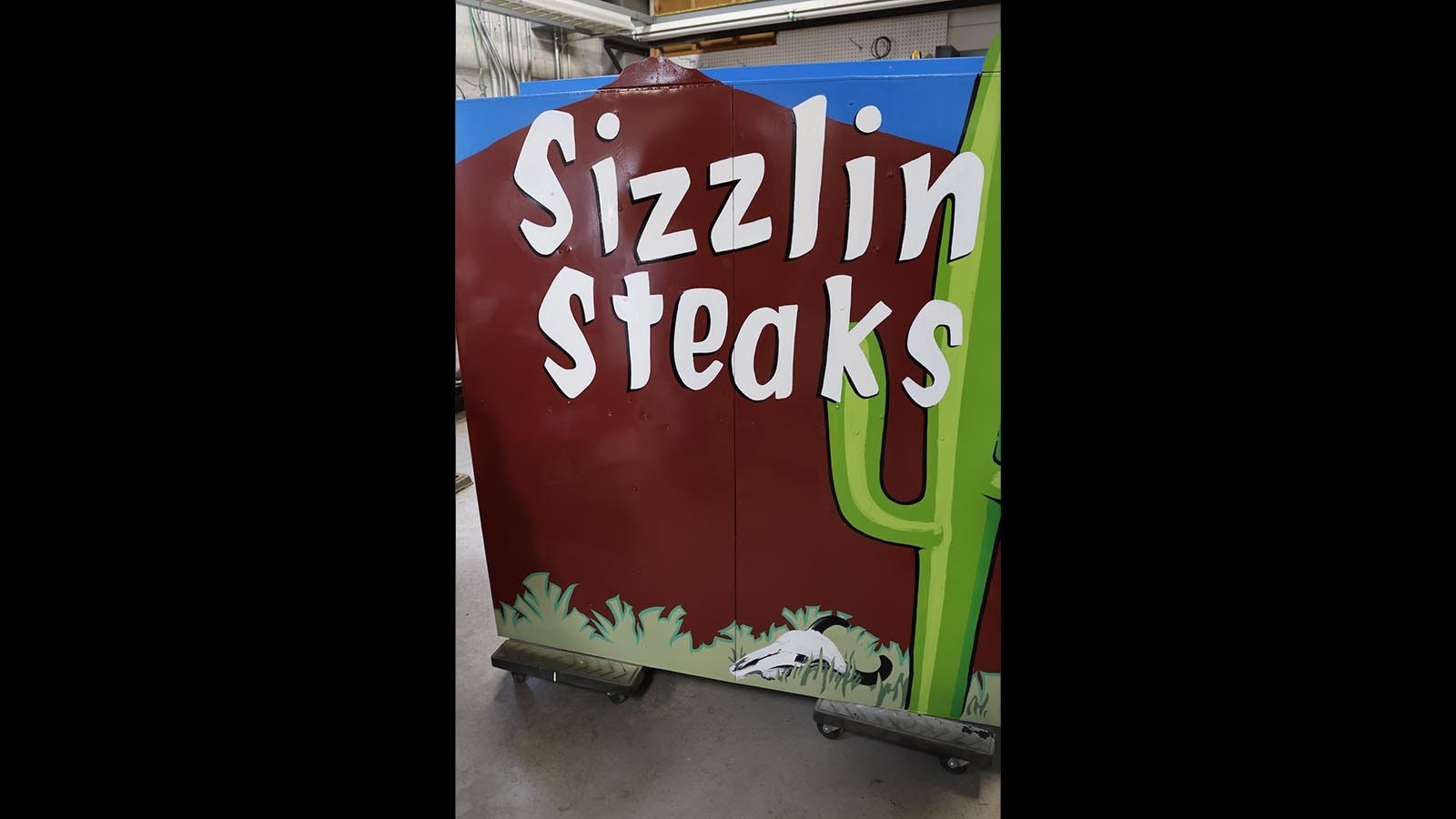 The bottom of the Tumble Inn Cowboy sign advertises the steaks that were once provided at the Powder River’s restaurant and bar.