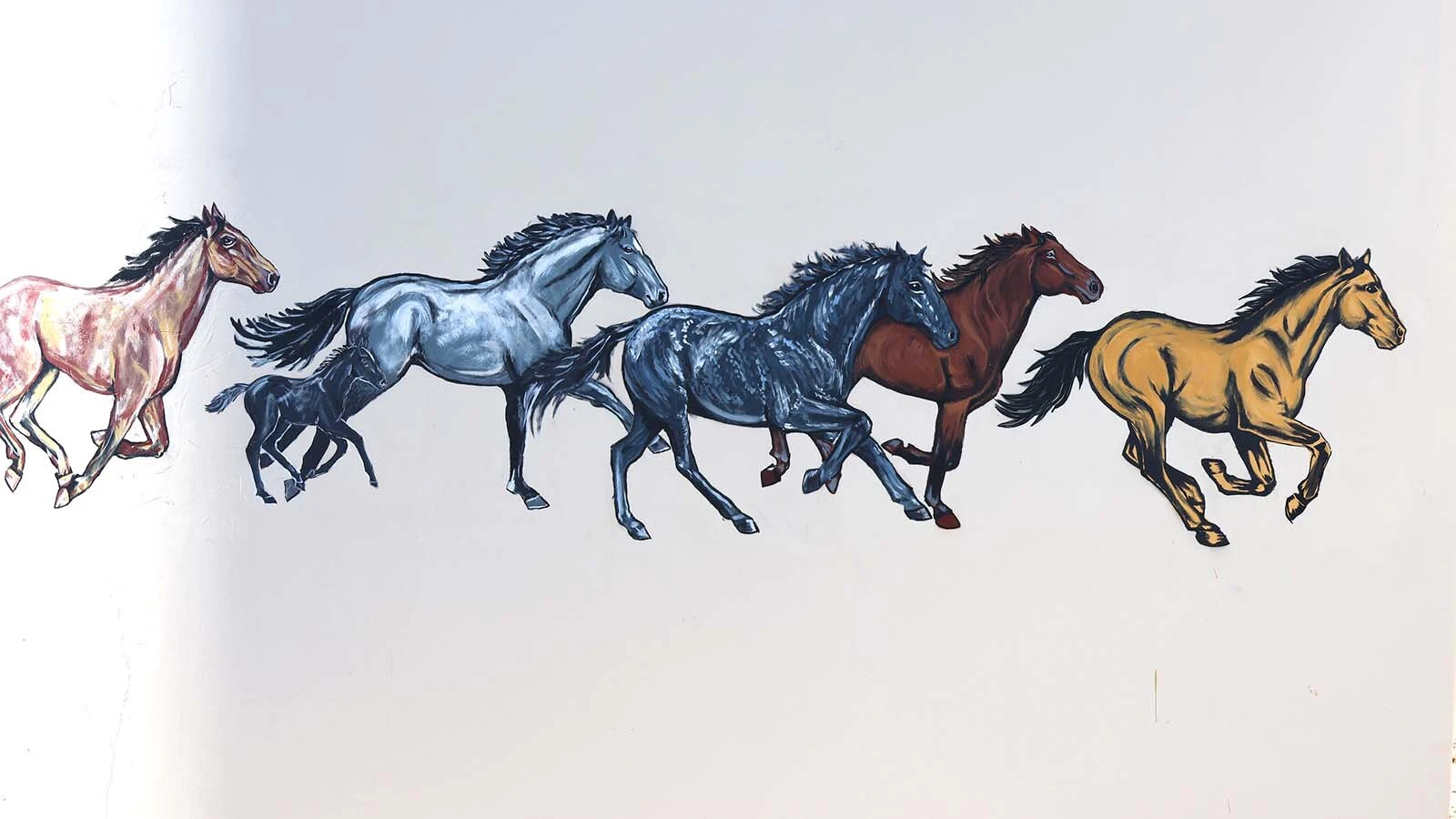 Running horses are the theme of “Windborne.”