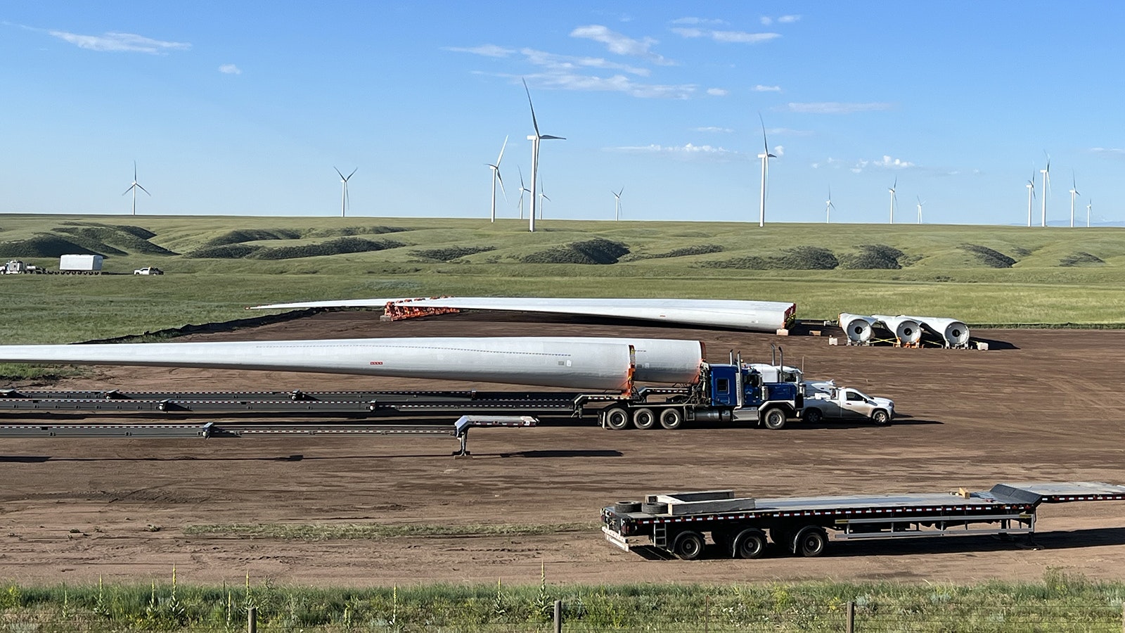 A large staging area for wind turbines along Interstate 80 between Cheyenne and Laramie has been busy so far this summer. But another Wyoming wind project will be delayed a year because of problems with turbine manufacturers.