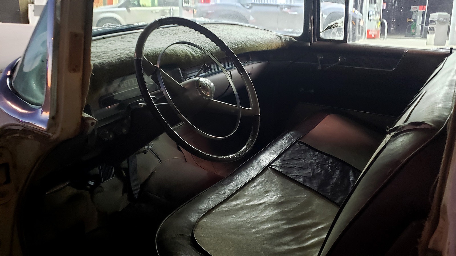 A peek inside the vintage interior of a two-headed Cadillac. The car is still driven in parades, where it does a few tricks, including crab-walking down the highway and spinning. It takes two people to drive, one in each end.