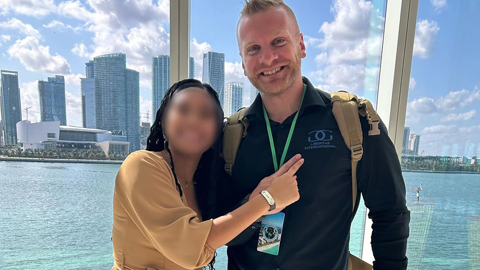 Tyler Schwab poses with one of more than 3,000 sex trafficking survivors his nonprofit has helped.