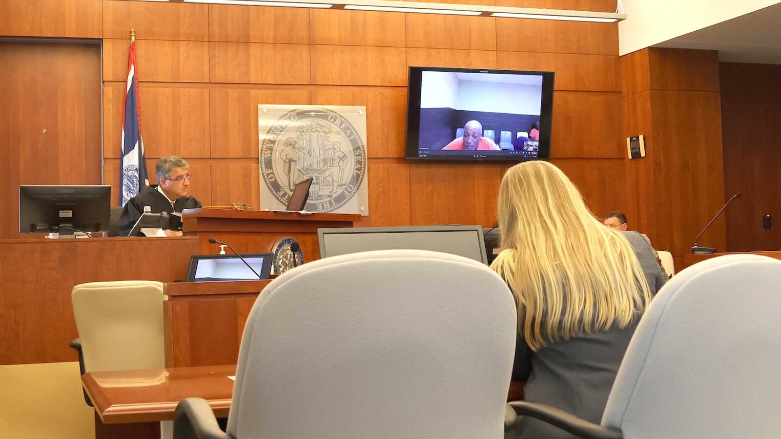 Casper Circuit Court Judge Kevin Taheri listens as Tyrone "T-Bone" Jackson answers a question at his initial appearance on Thursday. Jackson is charged with six drug-related felonies and two misdemeanors.