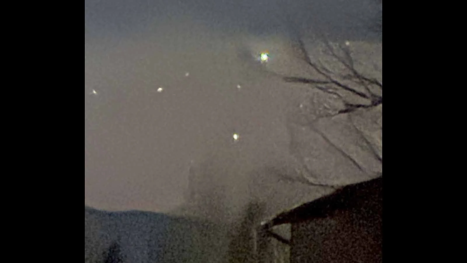 Mysterious lights rise in the night sky over Cedar Mountain near Cody, Wyoming.