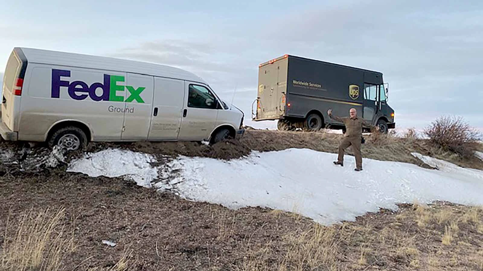When James Cary Lambert saw a FedEx driver stuck along his route, he couldn't resist making this photo, showing his unstuck UPS truck on the same route.