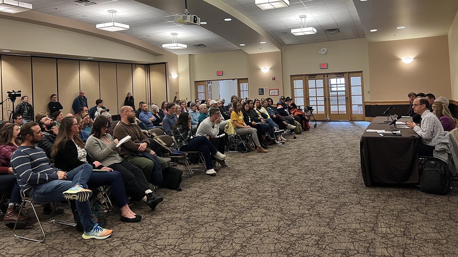 People listen to a panel discussion on Monday regarding whether to allow the carrying of concealed firearms on the University of Wyoming campus.