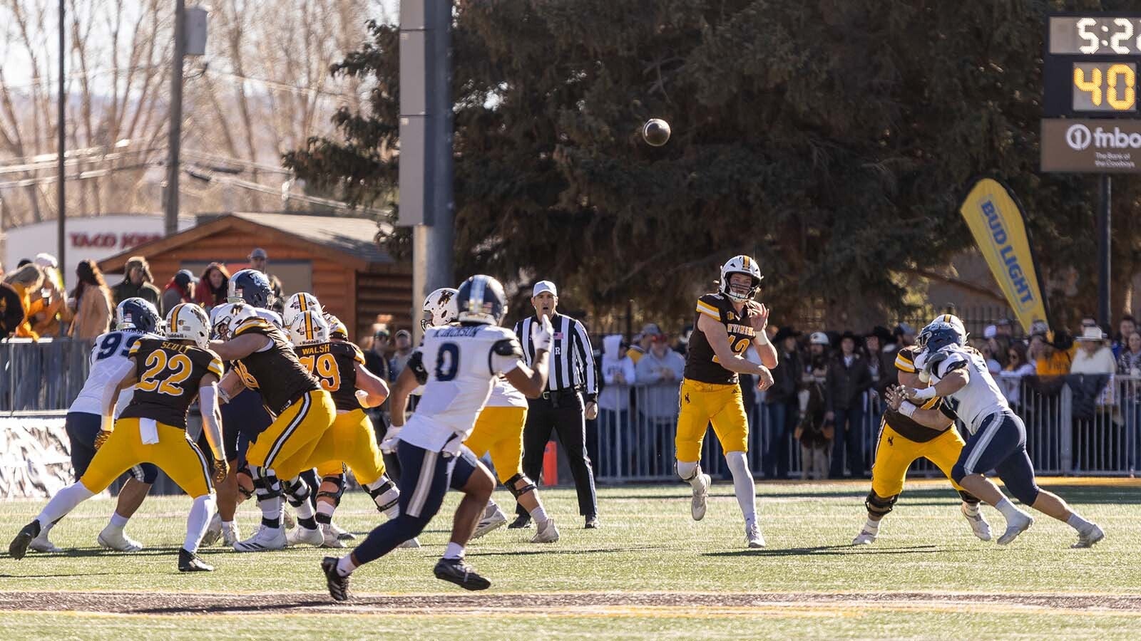 As the University of Wyoming struggles in the emerging name, image, likeness (NIL) age to fund its players, some wonder if dropping out of Division I makes sense. Meanwhile, UW boosters look for ways to fund NIL as lower FCS schools outspend them. Above, UW quarterback Kaden Anderson throws a pass Nov. 22, 2025, at War Memorial Stadium against Nevada, a loss for the Cowboys.