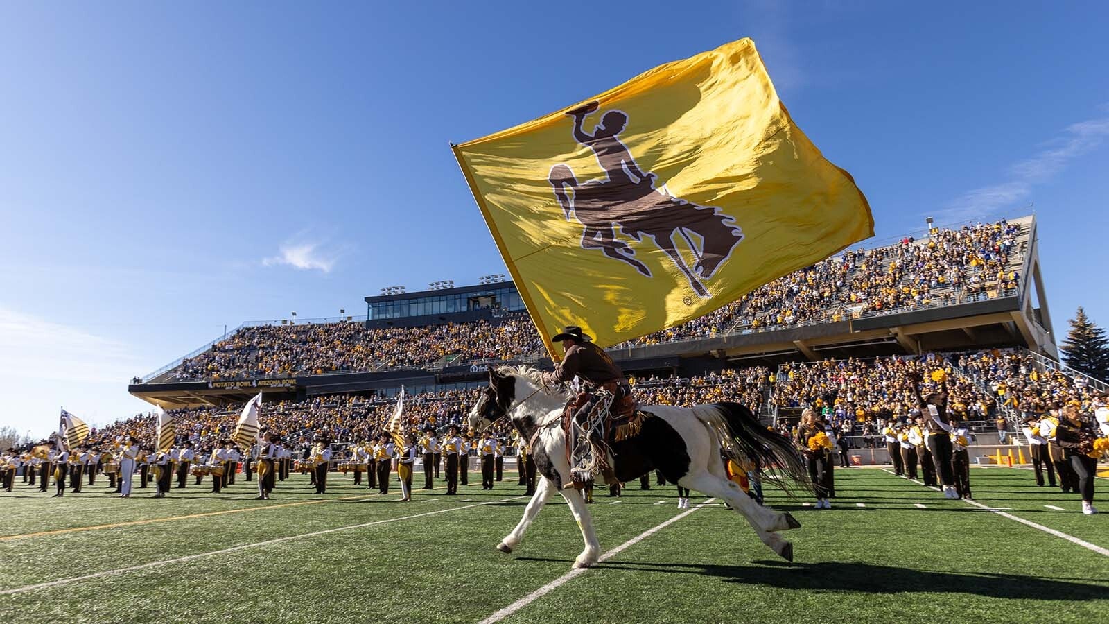 As the University of Wyoming struggles in the emerging name, image, likeness (NIL) age to fund its players, some wonder if dropping out of Division I makes sense. Meanwhile, UW boosters look for ways to fund NIL as lower FCS schools outspend them.