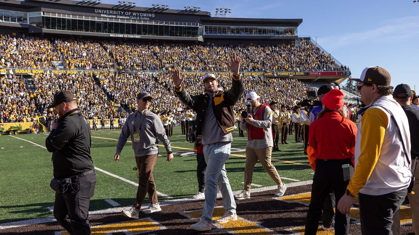 As the University of Wyoming struggles in the emerging name, image, likeness (NIL) age to fund its players, some wonder if dropping out of Division I makes sense. Meanwhile, UW boosters look for ways to fund NIL as lower FCS schools outspend them. Above, former UW star quarterback Josh Allen got a rousing welcome from fans at War Memorial Stadium on Nov. 22, 2025, when his jersey No. 17 was retired.