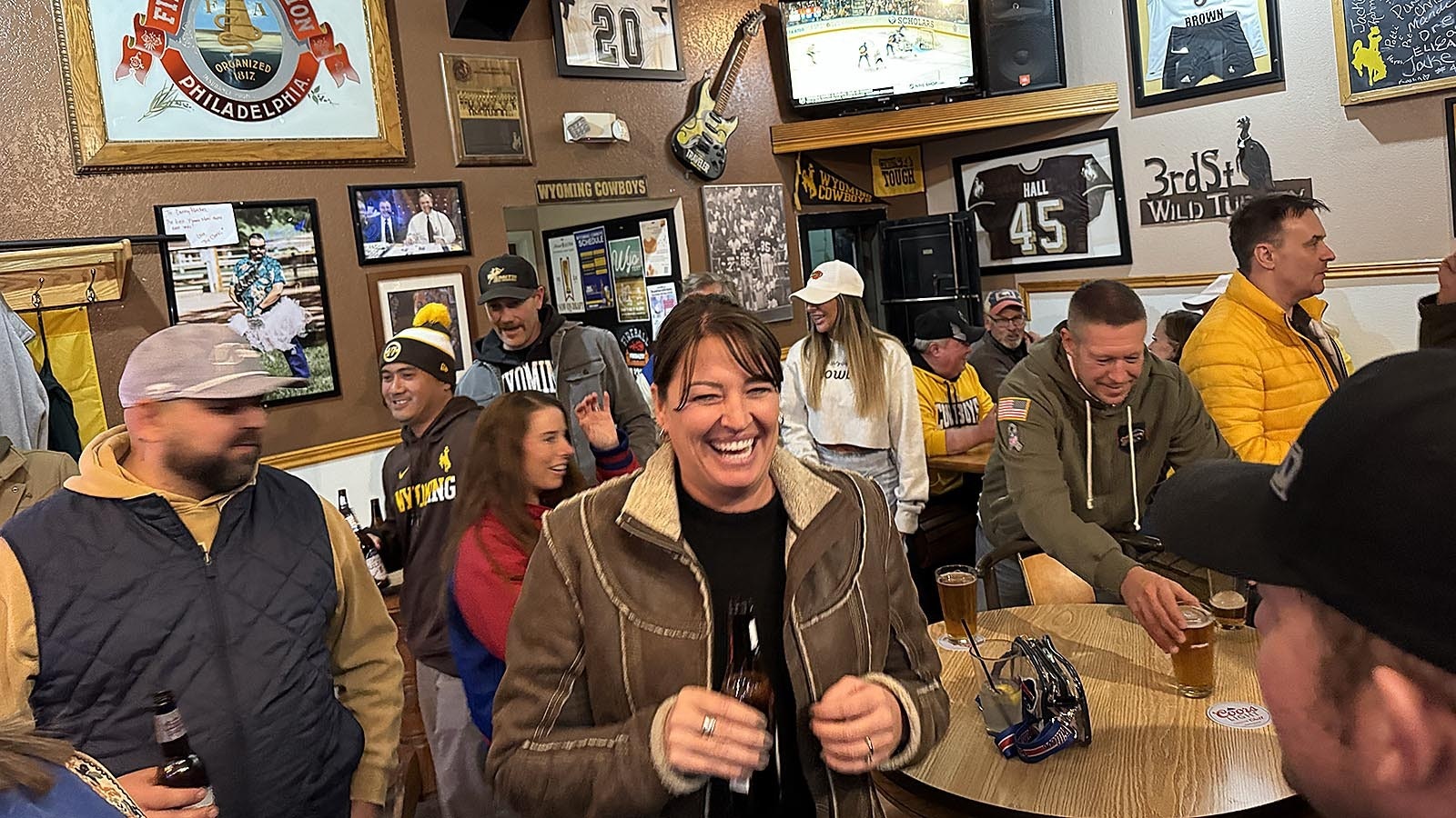 Fans hang out at 3rd Street Bar in downtown Laramie ahead of the big celebration Saturday.