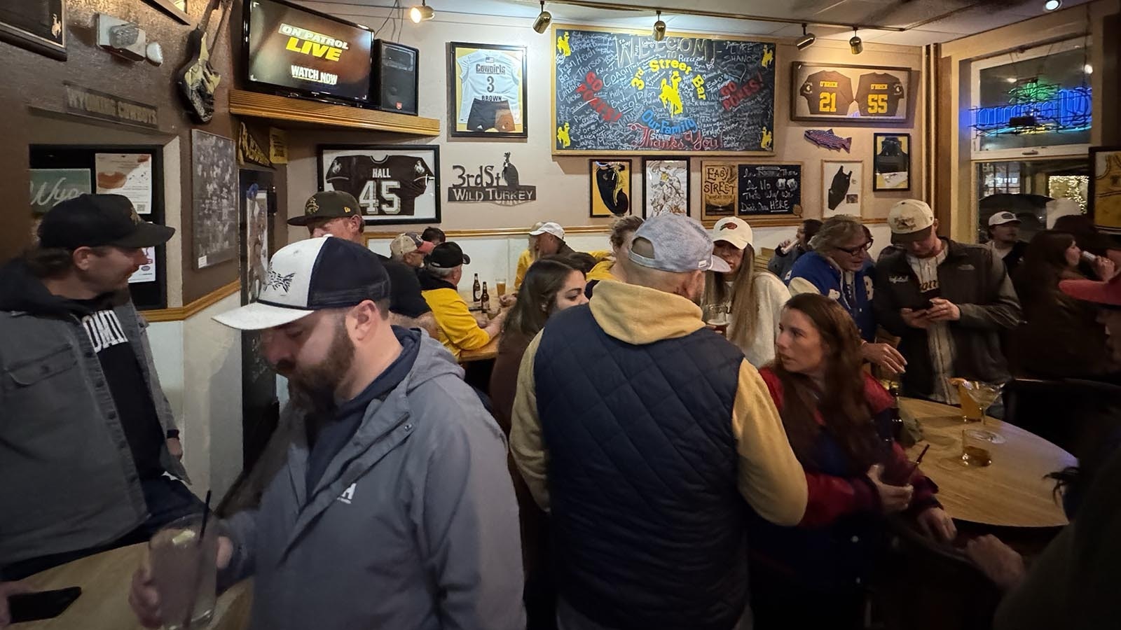 Fans hang out at 3rd Street Bar in downtown Laramie ahead of the big celebration Saturday.