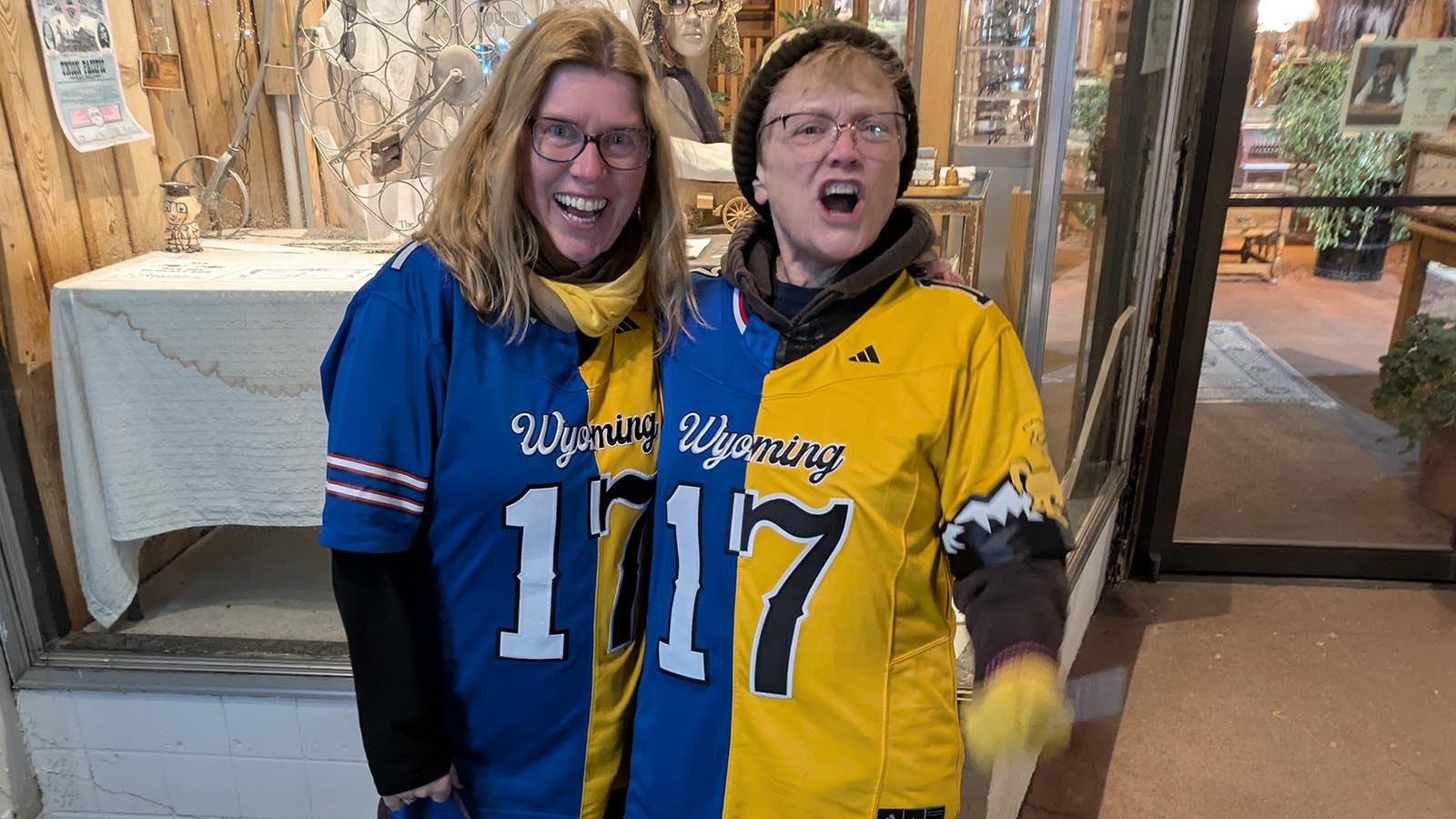 Petra Navarra and Terry Adams show off their Bills-Cowboys split jerseys in downtown Laramie.
