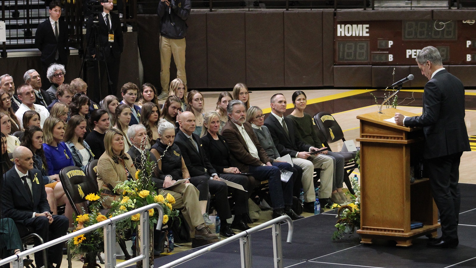 Gov. Mark Gordon speaks at a Wednesday memorial service for three University of Wyoming swimmers who were killed in a car crash Feb. 22, 2024.